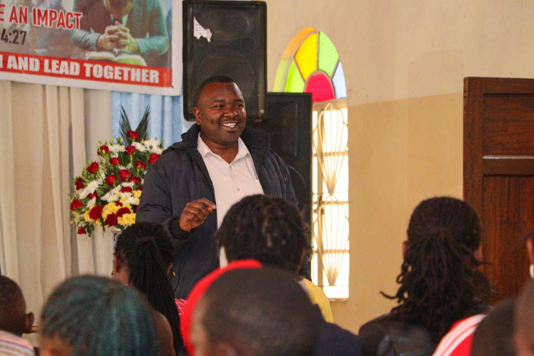 A teacher engaging youth in a faith session