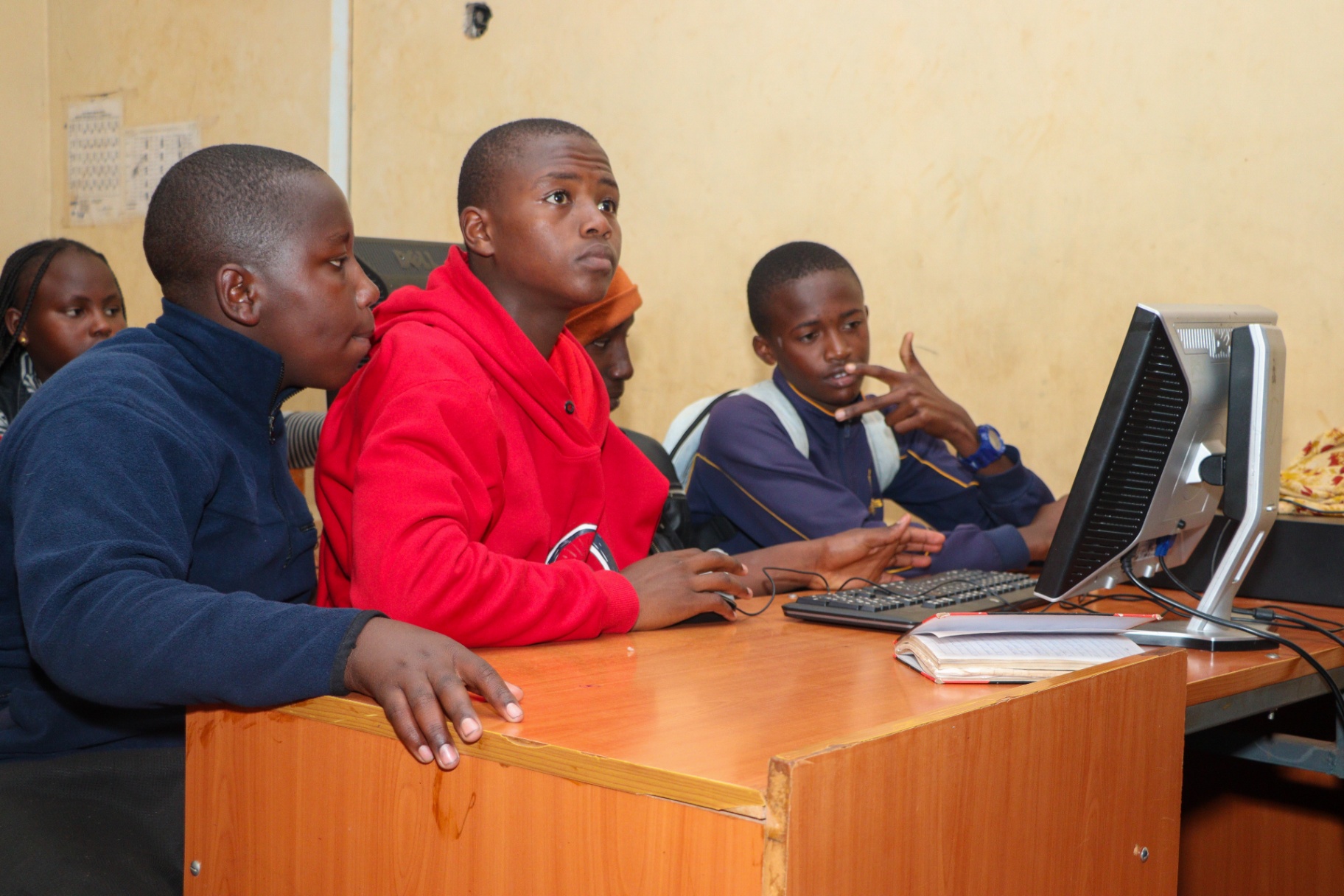 Youth working alongside a mentor on a live project
