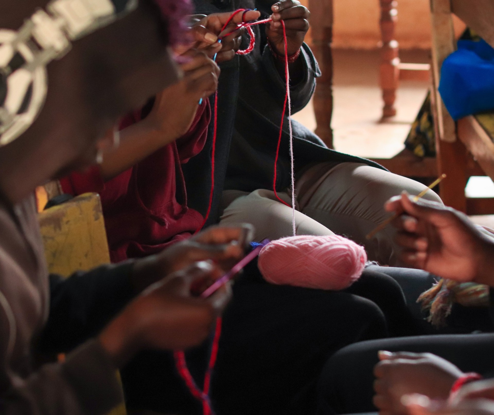 Hands crocheting a product at a GGF vocational hub